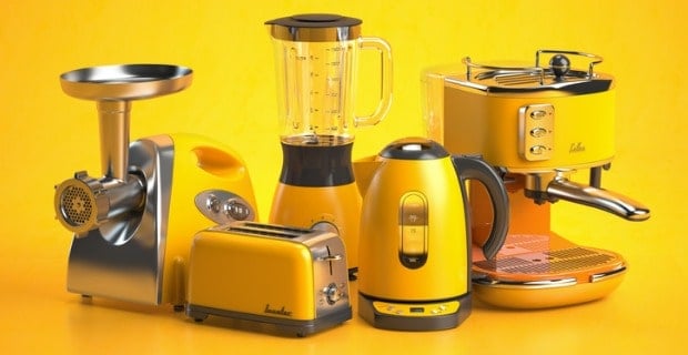 Ensemble d'appareils éléctroménagers jaunes sur fond jaune